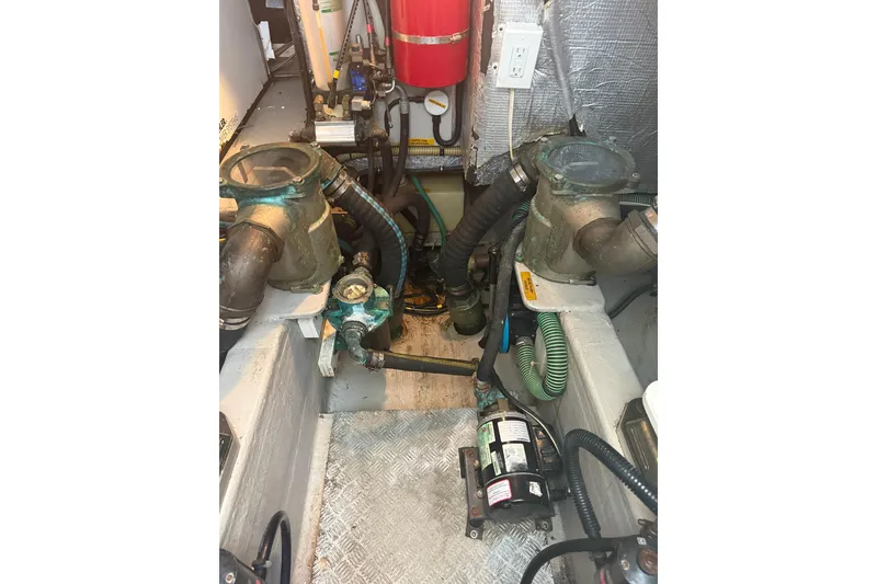 Slide: The Image of Engine room of 2008 Sunseeker Manhattan 50 yacht, featuring mechanical components and hoses. - 81
