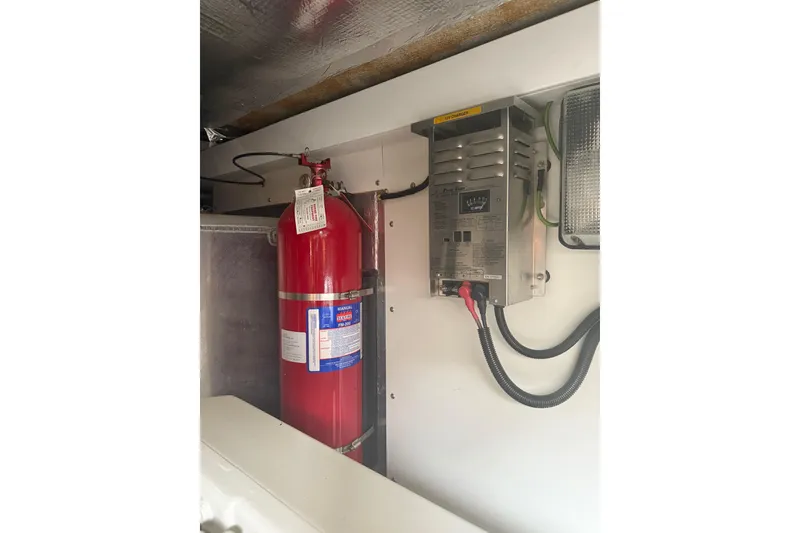 Slide: The Image of Fire extinguisher and electrical panel in 2008 Sunseeker Manhattan 50 yacht. - 91