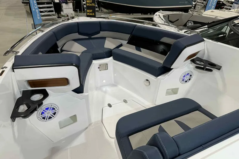 Slide: The Image of 2026 Monterey Elite 27 SD boat interior with blue seating and cup holders. - 10
