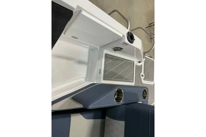 Slide: The Image of 2026 Monterey Elite 27 SD boat interior with sleek seating and cup holders. - 14