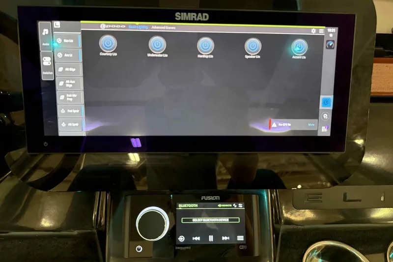 Slide: The Image of Touchscreen control panel in a 2026 Monterey Elite 27 SD boat, displaying lighting and audio options. - 7