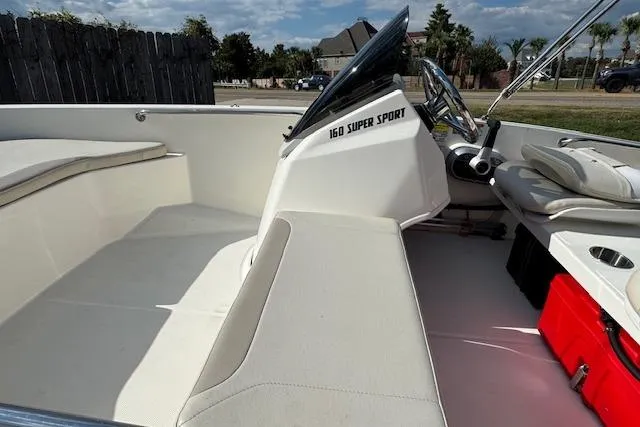 Slide: The Image of 2022 Boston Whaler 160 Super Sport interior with seating and steering wheel. - 19