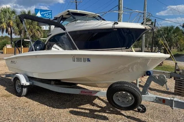 Slide: The Image of 2022 Boston Whaler 160 Super Sport boat on trailer, parked outdoors. - 5