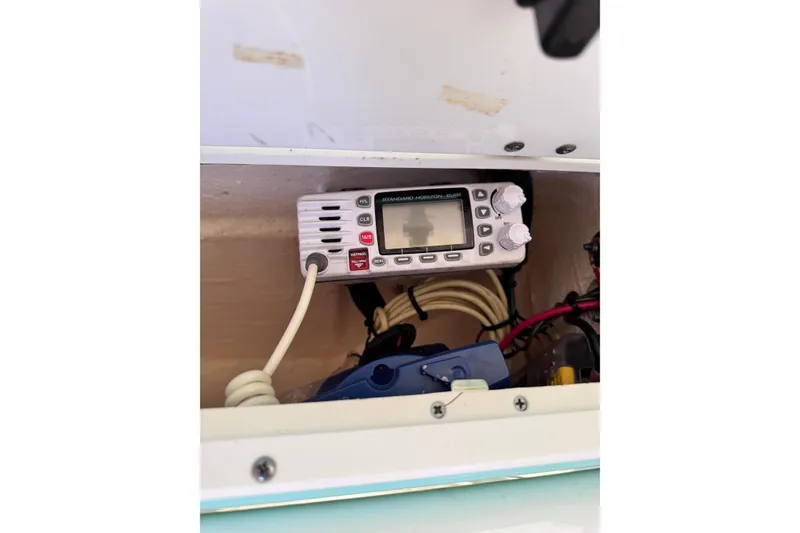 Slide: The Image of VHF radio installed in a 2017 Tidewater 220 CC Adventure boat compartment. - 13