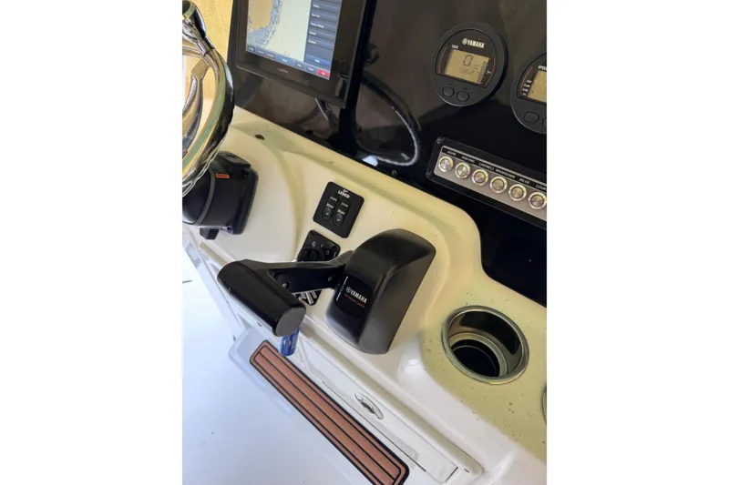 Slide: The Image of Control panel of 2017 Tidewater 220 CC Adventure boat with Yamaha throttle and gauges. - 14