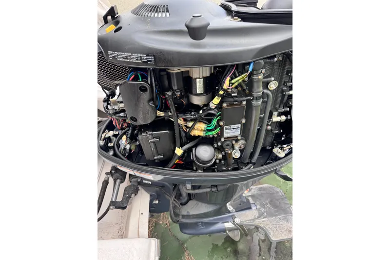 Slide: The Image of Open engine view of a 2017 Tidewater 220 CC Adventure boat. - 16