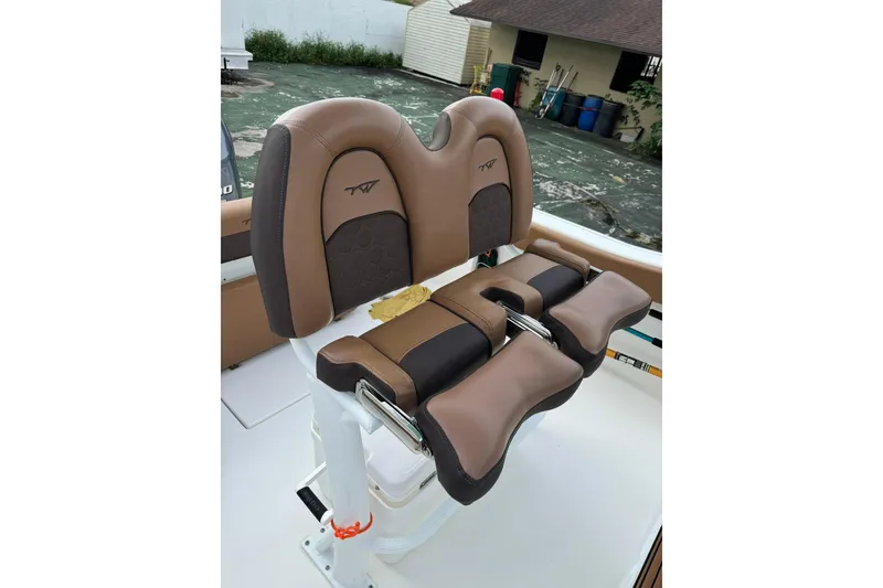 Slide: The Image of Brown and black seating on 2017 Tidewater 220 CC Adventure boat. - 3