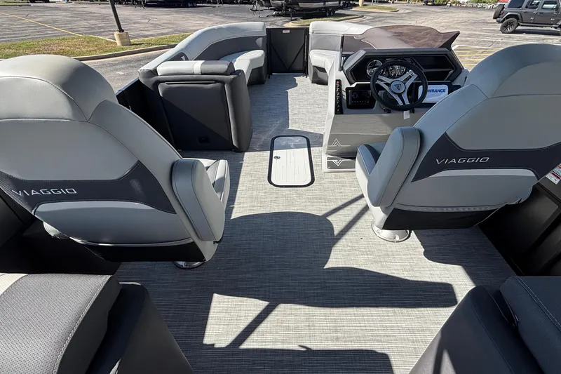 Slide: The Image of Interior of 2026 Viaggio X24U boat with modern seating and steering console. - 11