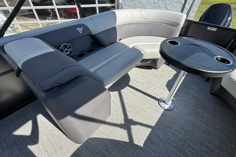 Slide: The Image of Luxurious seating area in 2026 Viaggio X24U boat with table and cup holders. - 19