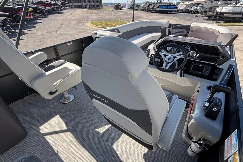 Slide: The Image of Interior view of 2026 Viaggio X24U boat, featuring modern steering and seating. - 22