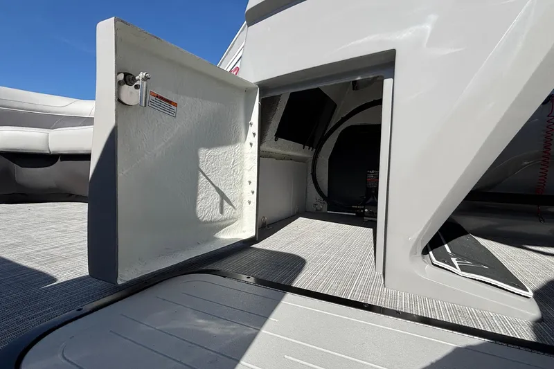 Slide: The Image of Open storage compartment on 2026 Viaggio X24U boat, showcasing interior space and design. - 24