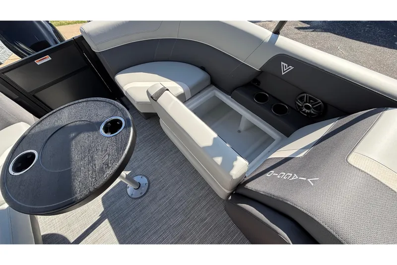 Slide: The Image of 2026 Viaggio X24U boat interior with seating, table, and cup holders. - 29