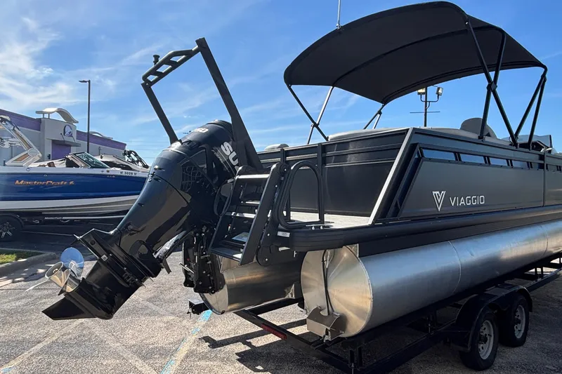 Slide: The Image of 2026 Viaggio X24U pontoon boat with outboard motor on trailer. - 3