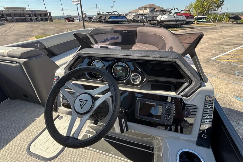 Slide: The Image of 2026 Viaggio X24U boat dashboard with steering wheel and navigation system. - 31