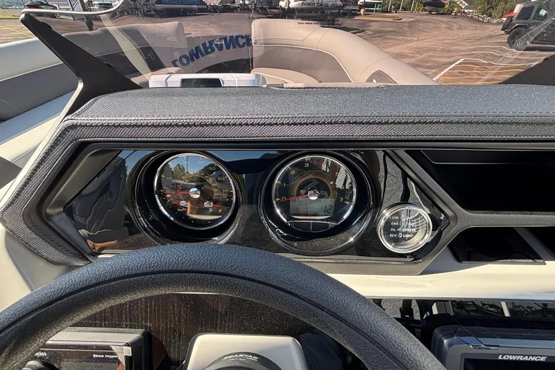 Slide: The Image of Dashboard of a 2026 Viaggio X24U boat with gauges and steering wheel. - 32