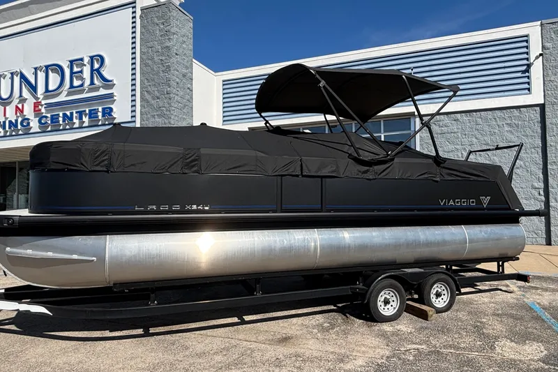 Slide: The Image of 2026 Viaggio X24U pontoon boat on trailer at dealership. - 34