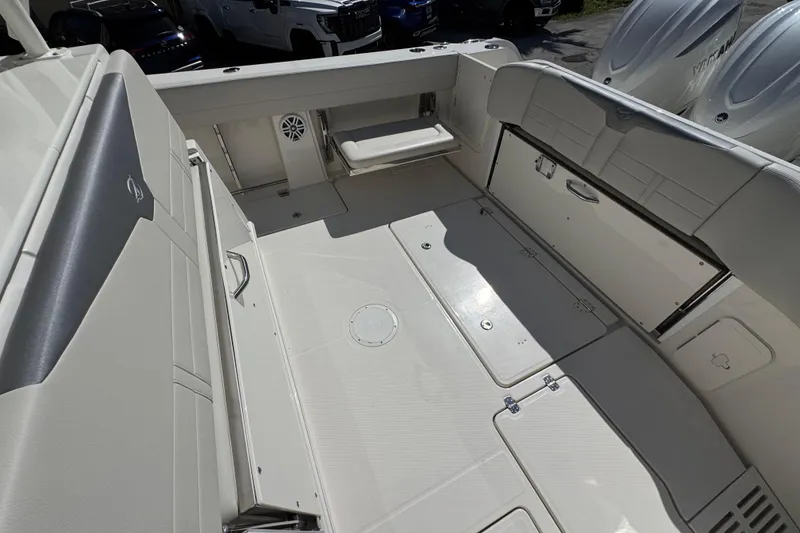 Slide: The Image of 2026 Sailfish 360 CC boat interior with spacious seating and storage compartments. - 11