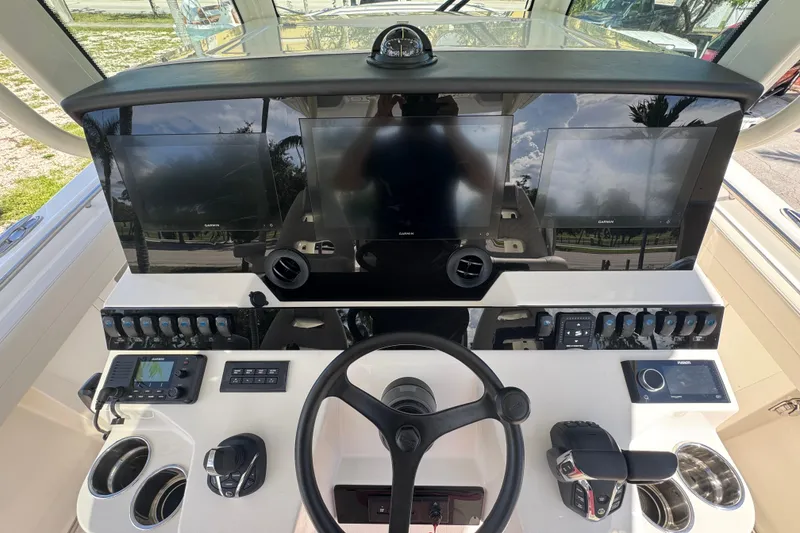 Slide: The Image of 2026 Sailfish 360 CC boat dashboard with advanced navigation and control systems. - 15
