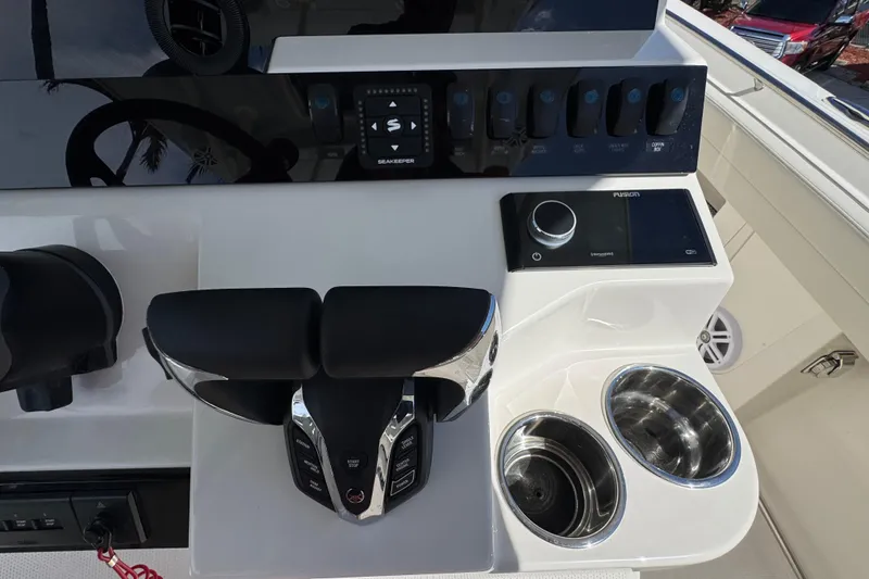 Slide: The Image of Control panel of 2026 Sailfish 360 CC boat with modern navigation and audio systems. - 17