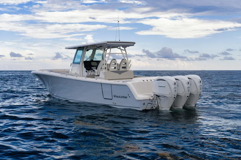 Slide: The Image of 2026 Sailfish 360 CC boat on open water with triple Yamaha engines. - 2