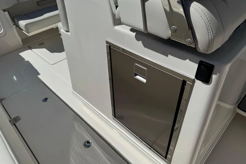 Slide: The Image of 2026 Sailfish 360 CC boat interior with stainless steel storage compartment. - 24