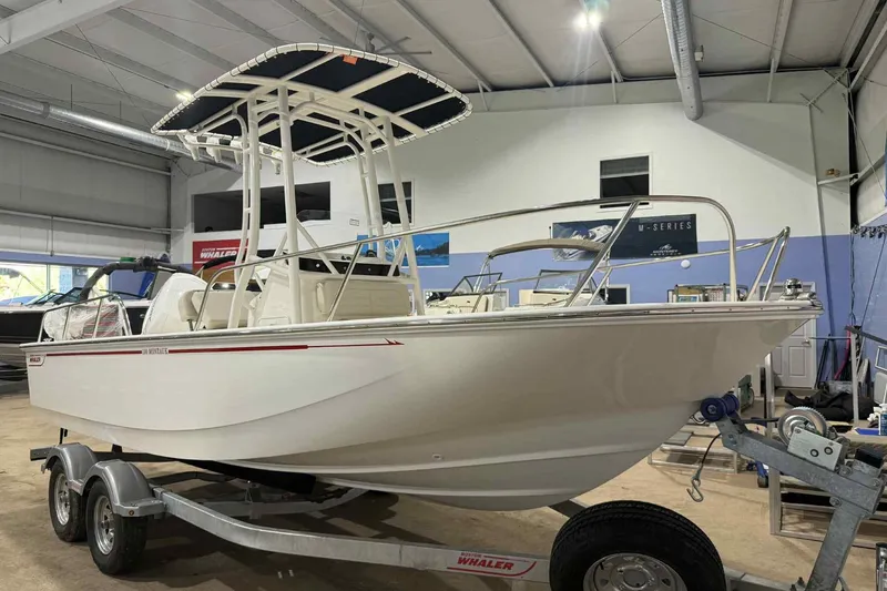 The Image of 2026 Boston Whaler 190 Montauk boat on trailer in showroom. - 0