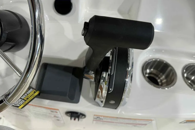 Slide: The Image of Close-up of 2026 Boston Whaler 190 Montauk boat controls and steering wheel. - 10