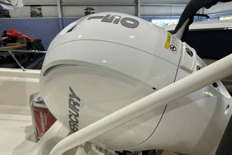 Slide: The Image of 2026 Boston Whaler 190 Montauk with Mercury outboard engine in showroom. - 16