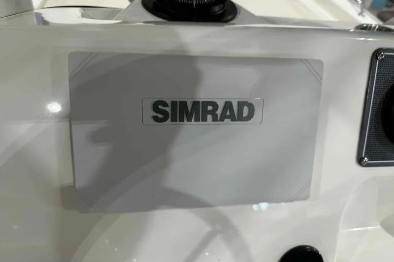 Slide: The Image of Simrad navigation system on 2026 Boston Whaler 190 Montauk boat dashboard. - 9