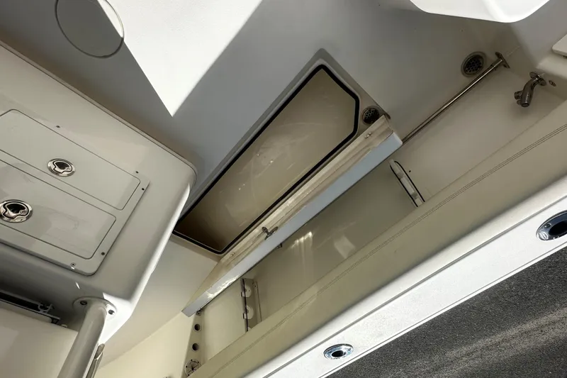 Slide: The Image of 2022 Cobia 262 Center Console boat interior storage compartment. - 11