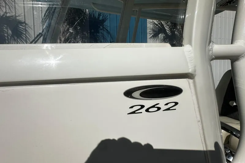 Slide: The Image of 2022 Cobia 262 Center Console boat detail with logo and model number. - 13
