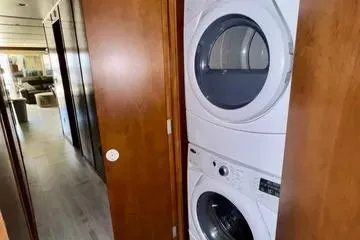 Slide: The Image of Stacked washer and dryer in Bravada Bella Luna 2013 interior hallway. - 10