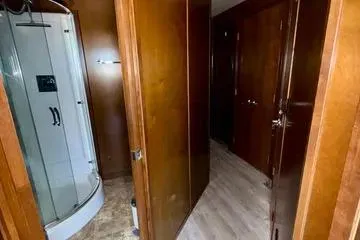 Slide: The Image of Interior of 2013 Bravada Bella Luna with wooden doors and modern shower. - 15