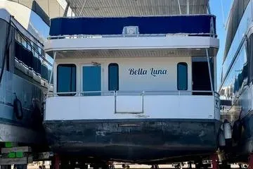 Slide: The Image of 2013 Bravada Bella Luna houseboat docked in a marina. - 23