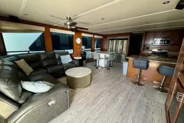 Slide: The Image of Luxurious interior of 2013 Bravada Bella Luna houseboat with modern kitchen and spacious seating area. - 3