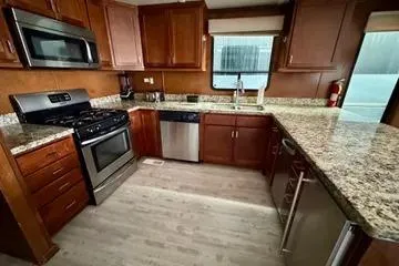 Slide: The Image of Modern kitchen in 2013 Bravada Bella Luna with granite countertops and stainless steel appliances. - 7