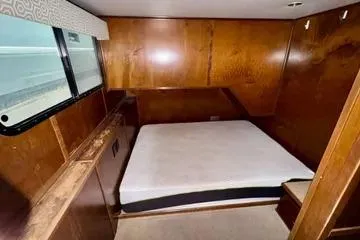 Slide: The Image of 2013 Bravada Bella Luna interior with wooden walls and a bed. - 9