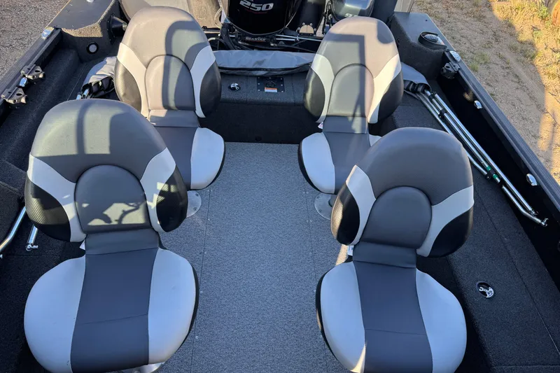 Slide: The Image of 2017 Alumacraft Competitor 205 Sport interior with four cushioned seats. - 12