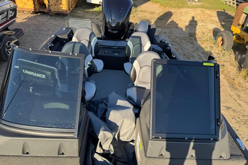 Slide: The Image of 2017 Alumacraft Competitor 205 Sport boat interior with seating and Lowrance equipment. - 20