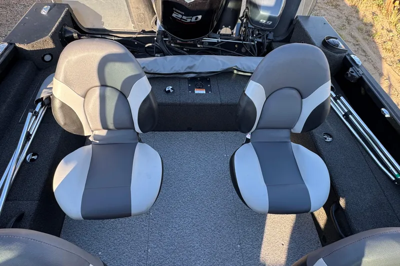 Slide: The Image of 2017 Alumacraft Competitor 205 Sport boat interior with two gray seats and Yamaha outboard motor. - 6