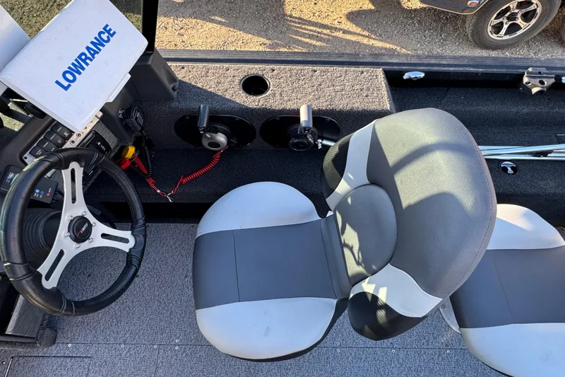 Slide: The Image of 2017 Alumacraft Competitor 205 Sport boat interior with steering wheel and Lowrance system. - 7