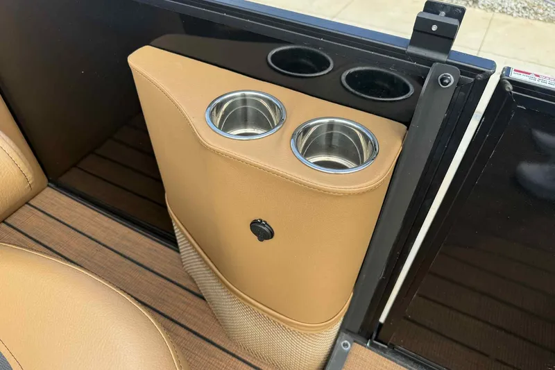 Slide: The Image of 2025 Bentley Pontoons Elite 253 Admiral cup holders with tan leather finish. - 16