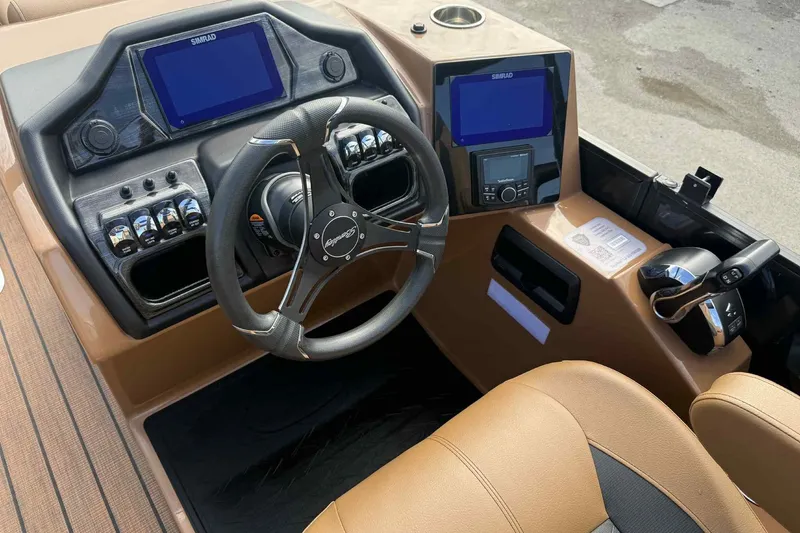 Slide: The Image of 2025 Bentley Pontoons Elite 253 Admiral dashboard with steering wheel and control panel. - 17