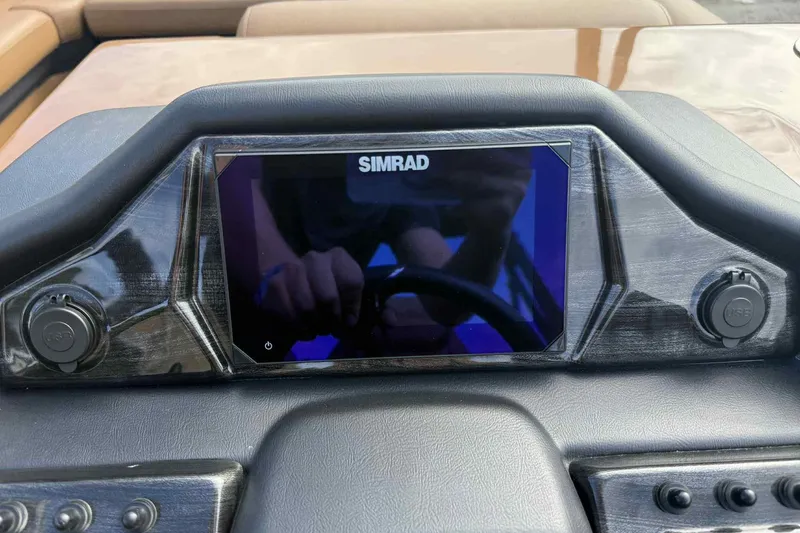 Slide: The Image of Dashboard of 2025 Bentley Pontoons Elite 253 Admiral with Simrad display and USB ports. - 18