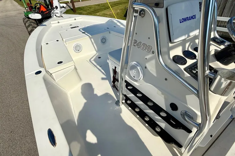 Slide: The Image of 2012 Pathfinder 2400 Tournament Edition boat with Lowrance electronics, docked on a sunny day. - 12