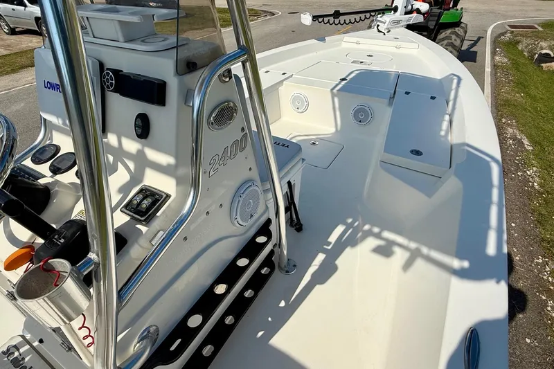 Slide: The Image of 2012 Pathfinder 2400 Tournament Edition boat with sleek white deck and control panel. - 14