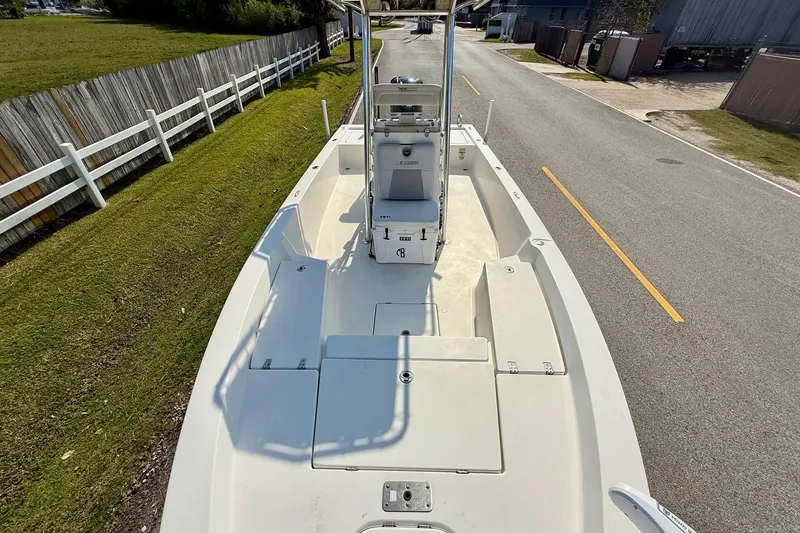 Slide: The Image of 2012 Pathfinder 2400 Tournament Edition boat on a road, showcasing spacious deck layout. - 15