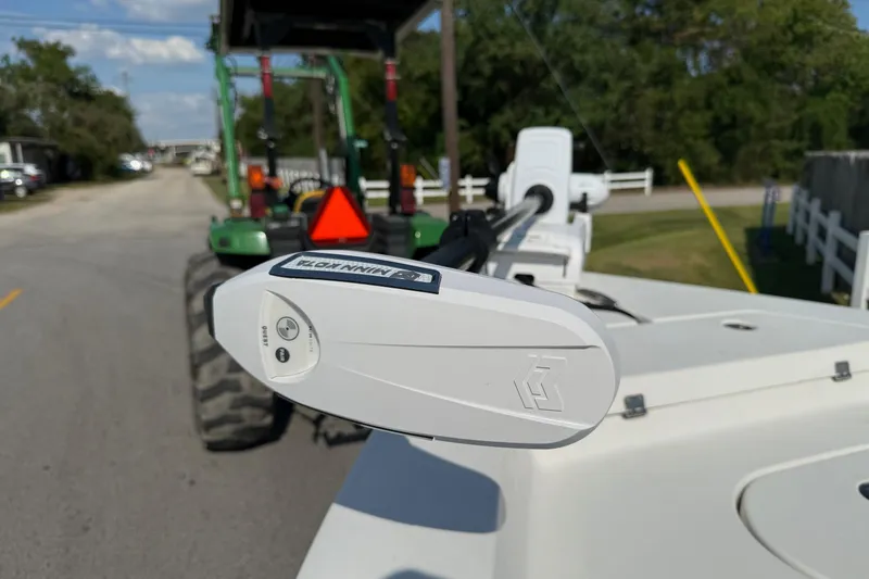 Slide: The Image of 2012 Pathfinder 2400 Tournament Edition with Minn Kota trolling motor on a sunny day. - 17