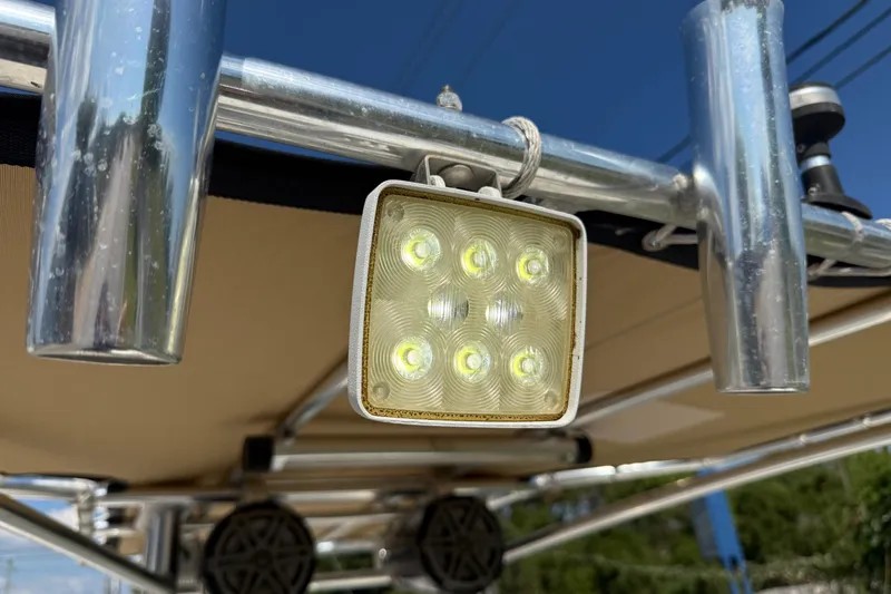 Slide: The Image of LED light on 2012 Pathfinder 2400 Tournament Edition boat's metal frame. - 19