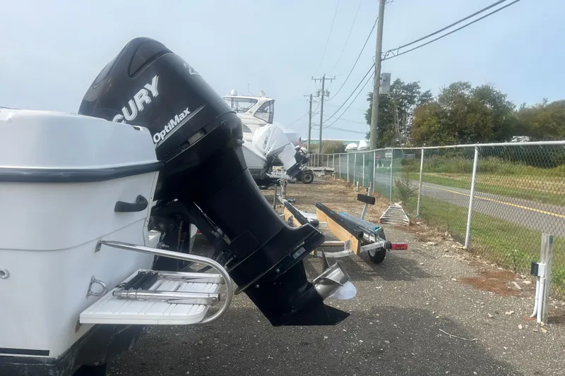 Slide: The Image of 2000 Seaswirl Striper 18.5 boat with Mercury OptiMax engine on trailer. - 4